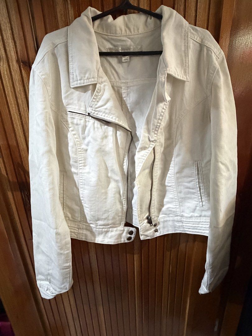 Lauren Conrad White Denim Moto Jacket (Category: Coats, Jackets and Outerwear) located in San Jose del Monte. Submitted by dcrishop (Listing ID 1449769362, Image 1). Description: - White denim jacket by Lauren Conrad - Moto style with asymmetrical zip front - Classic trucker jacket silhouette - Versatile for layering over tops or dresses - Suitable for casual or dressier outfits - Made in Indonesia.