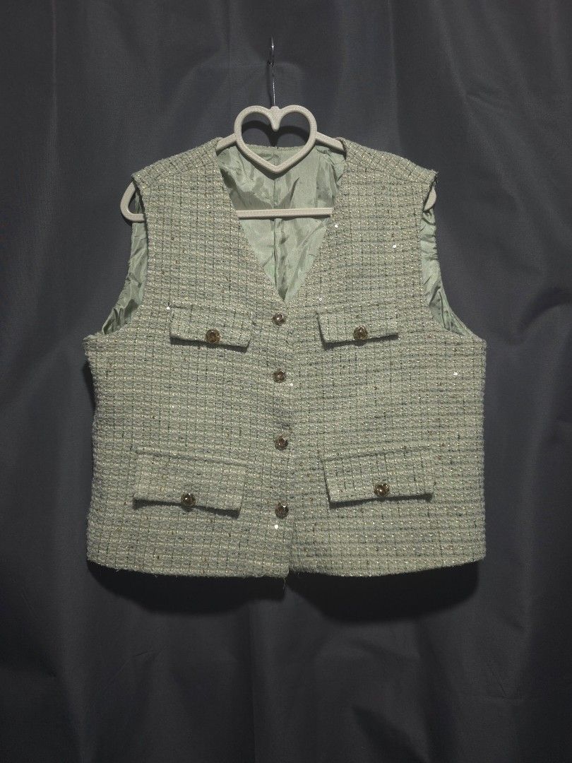 Light Green Tweed Vest with Sequins and Buttons (Category: Sleeveless) located in Mabalacat. Submitted by cheriepicked (Listing ID 1449948289, Image 1). Description: Light green tweed vest. Has a subtle sequin detail woven into the fabric. Features two chest pockets and two hip pockets. Buttons up the front. 36 bust. Shipping & Payment Details 📦 Shipping: Shipping fee to be shouldered by the buyer. 🚚 Method of Delivery (MOD): • Lalamove (for Pa