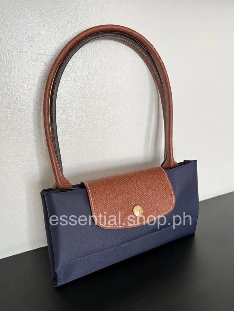 Longchamp Le Pliage LLH Navy (Category: Luxury Bags & Wallets) located in Manila. Submitted by essential.shop.ph (Listing ID 1403371236, Image 1). Description: FOR PRE-ORDER. 7-10 days ETA. Longchamp Le Pliage Large Long Handle Navy Inclusions: LGP zip lock, care card and paper bag Dimensions : 12.2 in (L - measured at the base of the bag) x 11.8 in (H) x 7.5 in (W).