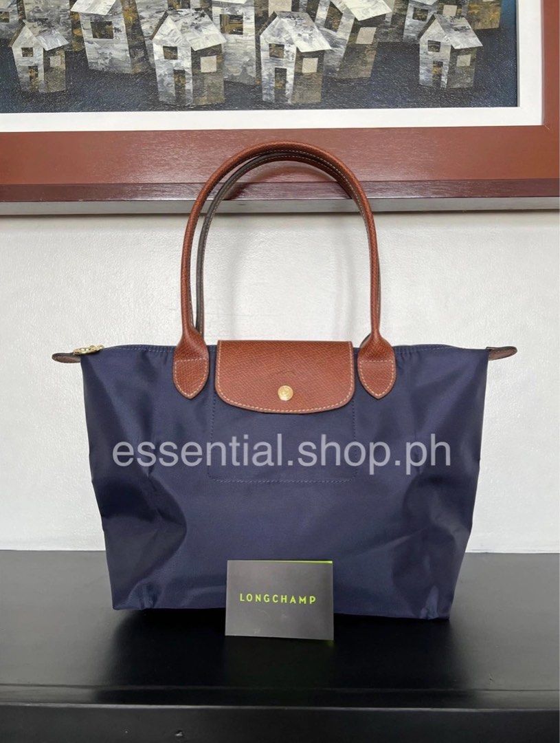 Longchamp Le Pliage LLH Navy (Category: Luxury Bags & Wallets) located in Manila. Submitted by essential.shop.ph (Listing ID 1403371236, Image 2). Description: FOR PRE-ORDER. 7-10 days ETA. Longchamp Le Pliage Large Long Handle Navy Inclusions: LGP zip lock, care card and paper bag Dimensions : 12.2 in (L - measured at the base of the bag) x 11.8 in (H) x 7.5 in (W).