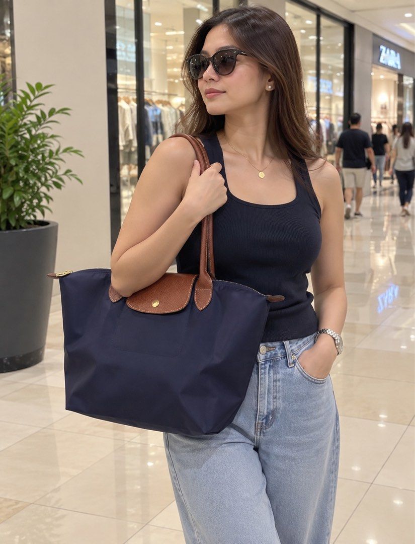 Longchamp Le Pliage LLH Navy (Category: Luxury Bags & Wallets) located in Manila. Submitted by essential.shop.ph (Listing ID 1403371236, Image 3). Description: FOR PRE-ORDER. 7-10 days ETA. Longchamp Le Pliage Large Long Handle Navy Inclusions: LGP zip lock, care card and paper bag Dimensions : 12.2 in (L - measured at the base of the bag) x 11.8 in (H) x 7.5 in (W).
