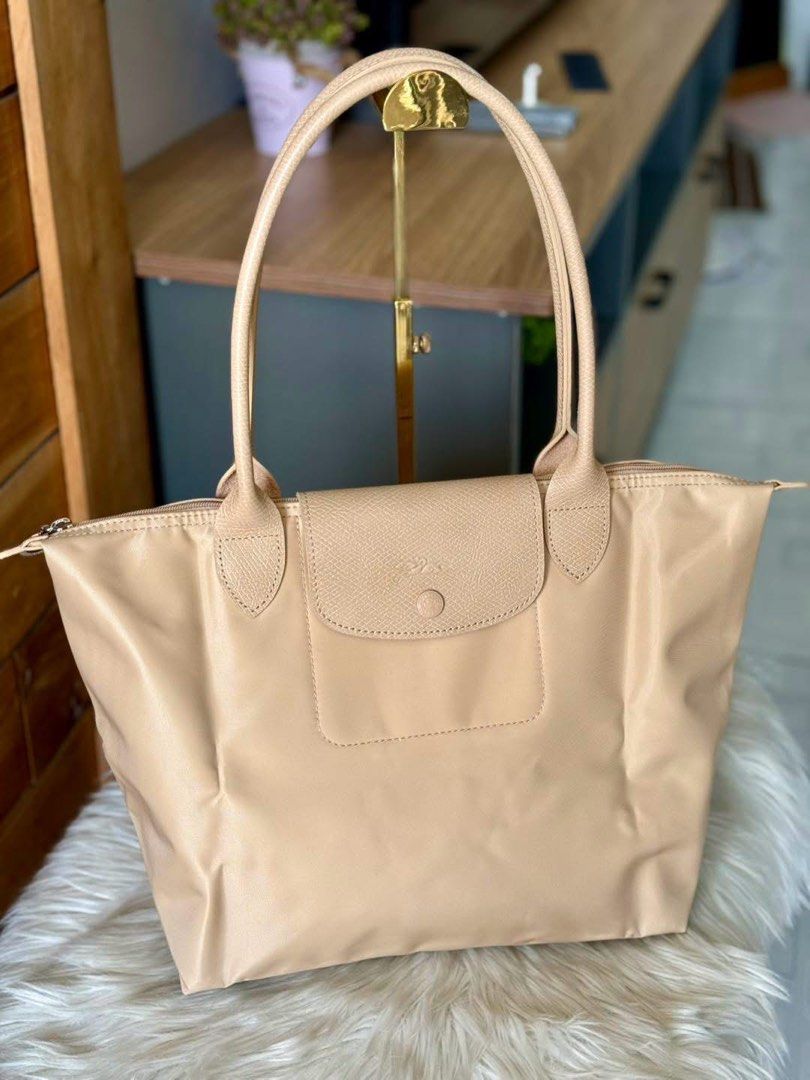 Longchamp Le Pliage Tote Bag (Category: Luxury Bags & Wallets) located in Manila. Submitted by clairetot (Listing ID 1449949983, Image 3). Description: Original Classic Longchamp tote bag in durable nylon with leather trim. Zip and snap closure. Spacious interior. Available in red, burgundy, and beige. Don’t buy if doubt 💗.
