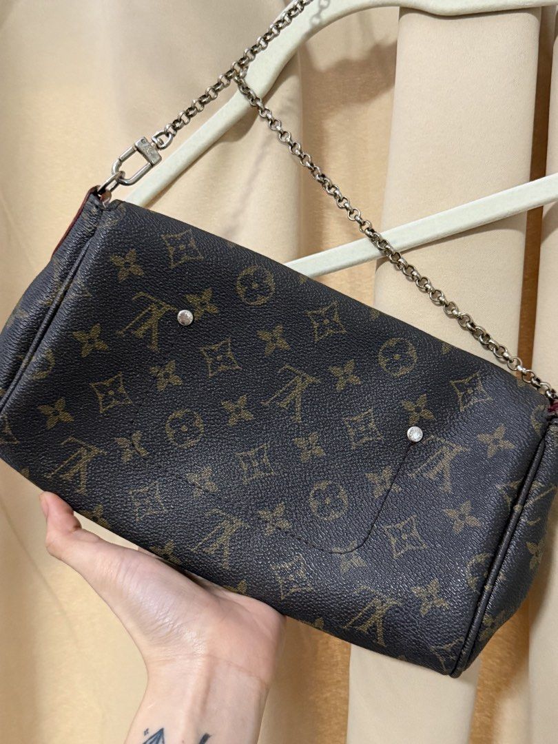 Louis Vuitton Monogram Pochette Accessoire Bag (Category: Luxury Bags & Wallets) located in Batangas. Submitted by luckybear77 (Listing ID 1449786199, Image 2). Description: - Authentic Louis Vuitton Monogram Pochette - Classic brown and tan canvas - Silver hardware - Detachable chain strap - Compact and ideal for essentials - Clean interior - Exterior shows some signs of wear on canvas and hardware.