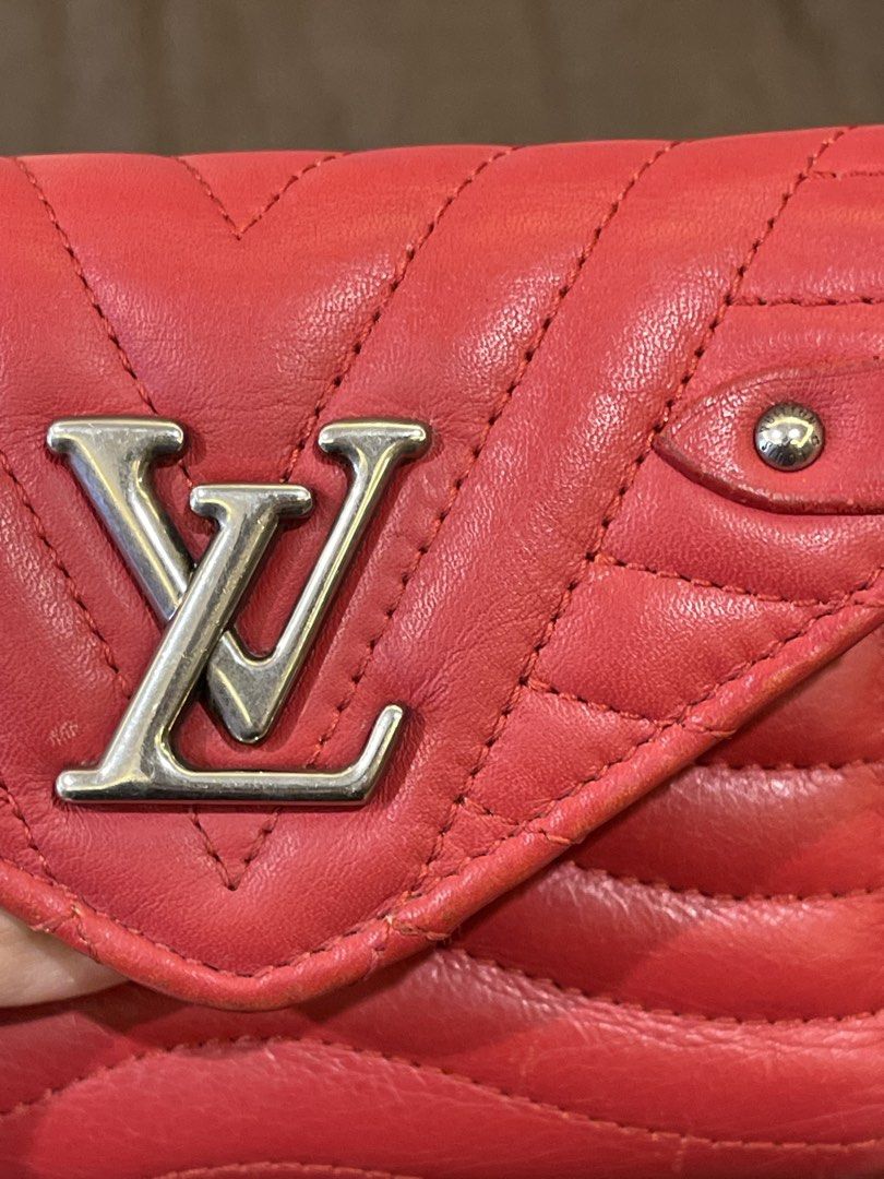 Louis Vuitton Red Leather Wallet (Category: Luxury Bags & Wallets) located in Manila. Submitted by jnjsluxury (Listing ID 1449810123, Image 2). Description: - Authentic red Louis Vuitton wallet - Quilted leather with iconic LV logo - Features a small wrist strap with colorful lettering - Minor wear on edges, as pictured - Plenty of life remaining, perfect for everyday use Heavily used with scuffings on the corners A bit of peeling in the zipper p