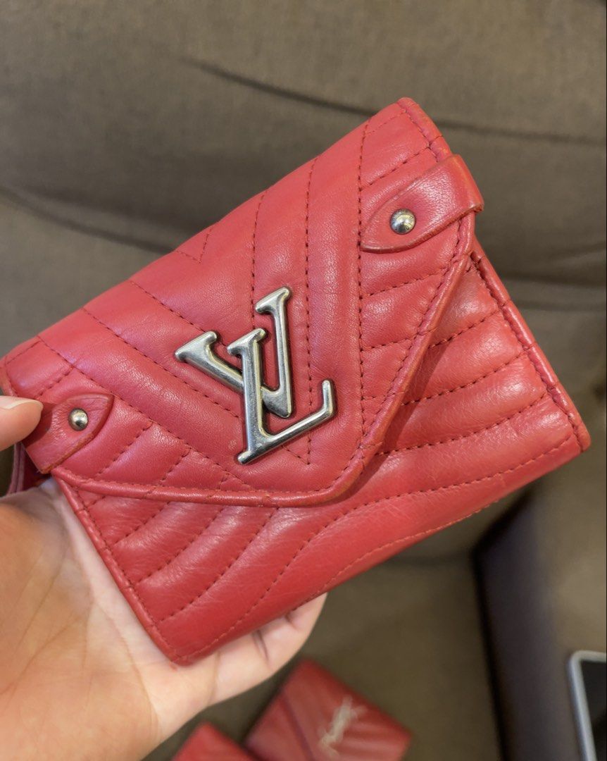 Louis Vuitton Red Leather Wallet (Category: Luxury Bags & Wallets) located in Manila. Submitted by jnjsluxury (Listing ID 1449810123, Image 1). Description: - Authentic red Louis Vuitton wallet - Quilted leather with iconic LV logo - Features a small wrist strap with colorful lettering - Minor wear on edges, as pictured - Plenty of life remaining, perfect for everyday use Heavily used with scuffings on the corners A bit of peeling in the zipper p