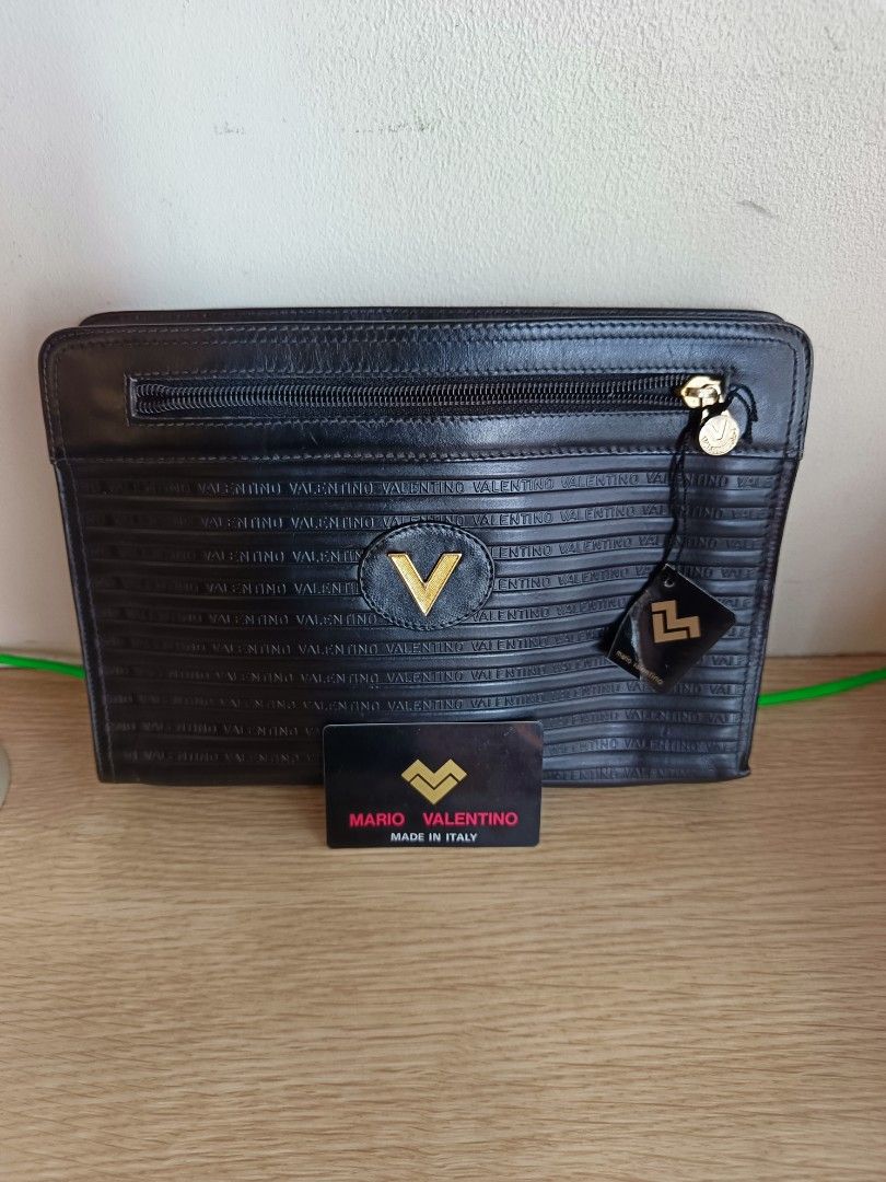 Mario Valentino Clutch Bag (Category: Luxury Bags & Wallets) located in Manila. Submitted by aprilis25 (Listing ID 1449904929, Image 2). Description: Mario Valentino Clutch bag Brand is Mchson Good condition with no issue Original with authentic card selling for 1200.