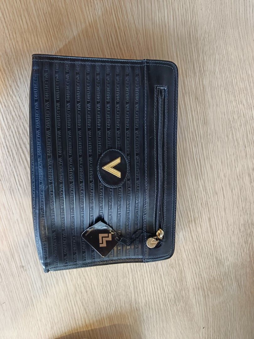 Mario Valentino Clutch Bag (Category: Luxury Bags & Wallets) located in Manila. Submitted by aprilis25 (Listing ID 1449904929, Image 3). Description: Mario Valentino Clutch bag Brand is Mchson Good condition with no issue Original with authentic card selling for 1200.