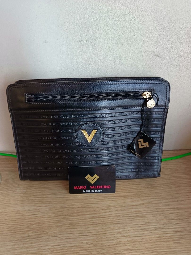 Mario Valentino Clutch Bag (Category: Luxury Bags & Wallets) located in Manila. Submitted by aprilis25 (Listing ID 1449904929, Image 1). Description: Mario Valentino Clutch bag Brand is Mchson Good condition with no issue Original with authentic card selling for 1200.