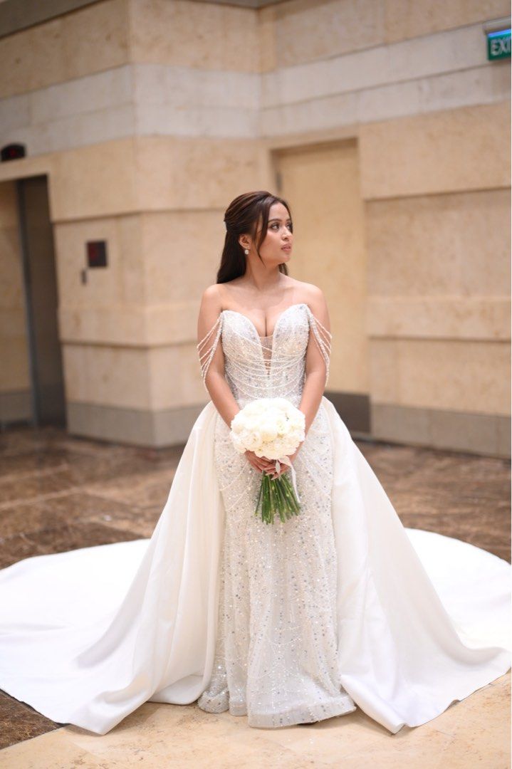 Mark Brides Wedding Gown (Category: Evening dresses & gowns) located in Manila. Submitted by andreagutierrez_13 (Listing ID 1449761887, Image 1). Description: Finally letting go of this masterpiece by Mark Brides Manila. ✨ • 2 Way Gown • With Mantilla Veil Worn only once on June 13, 2026, and the gown has not been dry cleaned yet. Original purchase price: ₱170,000 Selling price: ₱100,000 only (still NEGOTIABLE) If you’re interested or would like 