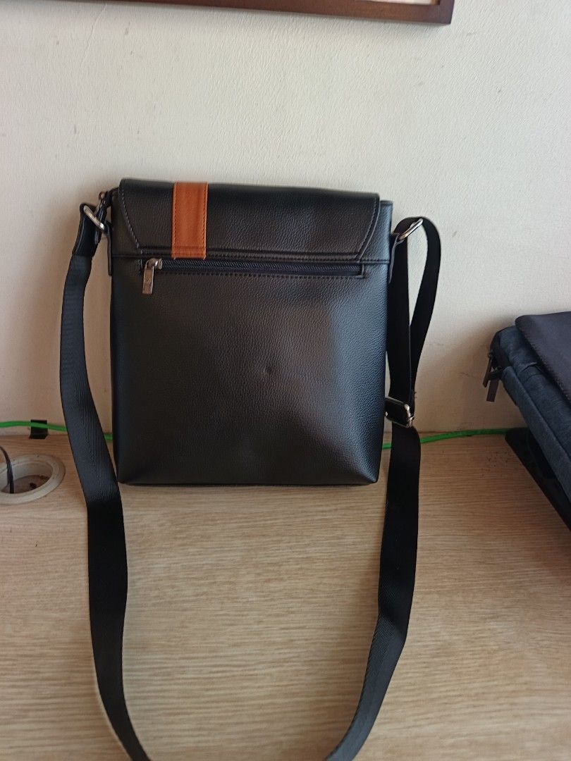 McJim Leather Bag (Category: Luxury Bags & Wallets) located in Manila. Submitted by aprilis25 (Listing ID 1449904206, Image 3). Description: McJim Leather Sling Bag With Compartments for laptop and Ipad Brand is Mcjim 1999 only Very new in excellent condition.