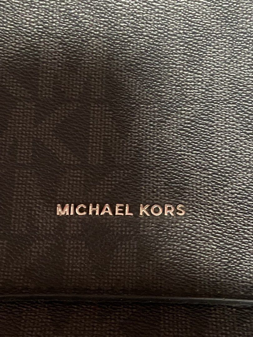 Michael Kors Monogram Crossbody Bag Black (Category: Luxury Bags & Wallets) located in Caloocan City. Submitted by wayneitems (Listing ID 1449916123, Image 2). Description: - Authentic Michael Kors crossbody bag - Features all-over MK monogram print - Adjustable strap with MK branding - Ideal for everyday use - ISSUES ARE POSTED SEE LAST 2 PICTURES.