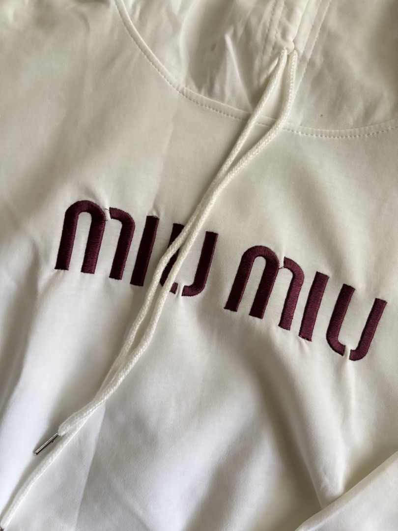 Miu Miu White Cropped Hoodie (Category: Luxury Apparel) located in Masbate. Submitted by pinkshoppe.ph (Listing ID 1449947876, Image 2). Description: - White cropped hoodie - Features Miu Miu logo - Drawstring hood and hem for adjustable fit - Long sleeves with elastic cuffs - Super comfy and stylish design - Ideal for everyday casual wear.