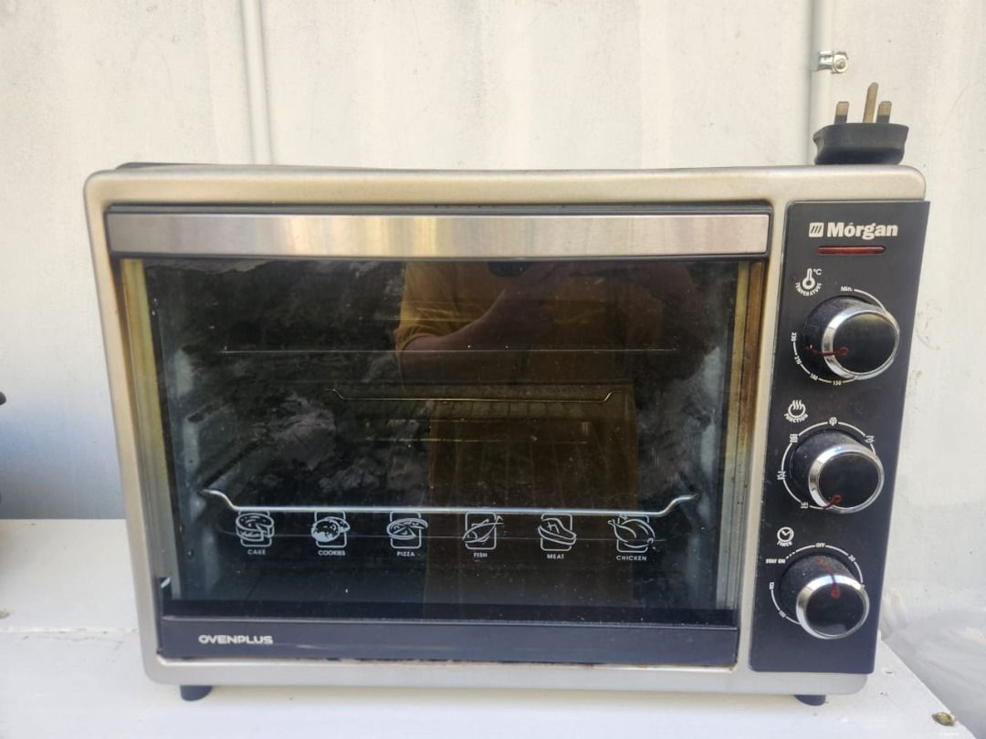 Morgan Electric Oven 25L (Category: Bakeware) located in Kota Kinabalu. Submitted by blossomb.co (Listing ID 1449842307, Image 2). Description: Selling pre-loved. "Morgan Electric Oven 25L" that is perfect for grilling, baking and toasting. It has temperature selector 0°C to 230°C with 60 minutes switch off timer. It comes with four stages heating selector: off / upper heating / lower heating / upper & lower heating. It has 7 Function selectors f