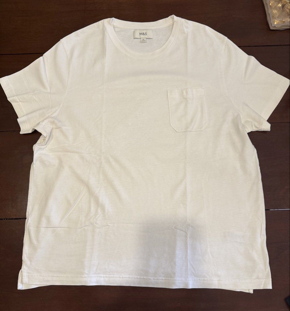 M&S White Pocket T-Shirt (Category: Tshirts & Polo Shirts ) located in Makati City. Submitted by nemkd (Listing ID 1449773555, Image 1). Description: - Classic white t-shirt from M&S - Features a convenient chest pocket - Made from soft, comfortable cotton material - Versatile for everyday wear, layering, or wearing solo - Effortlessly pairs with any outfit.