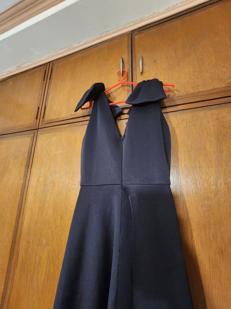 Navy Blue Neoprene Midi Dress (Category: Dresses) located in Paranaque City. Submitted by kachdeclutters (Listing ID 1449771472, Image 2). Description: - Navy blue neoprene midi dress - V-neckline with bow details on shoulders - Back zipper closure - Ideal for events and parties.