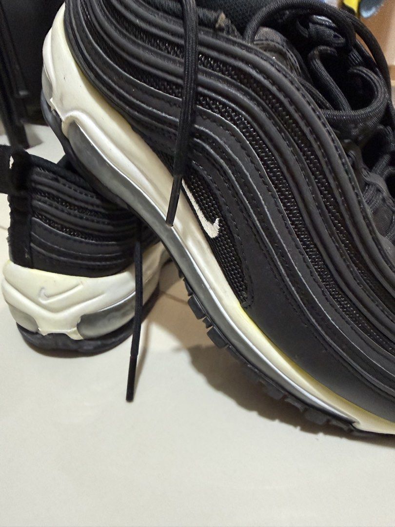 Nike Air Max 97 Black (Category: Sneakers) located in Caloocan City. Submitted by handdown_wear (Listing ID 1449884605, Image 3). Description: - Nike Air Max 97 - Color: Black - Size: US 8 / EUR 39 - Features classic wavy design - Ideal for everyday wear - Condition: Some yellowing on the midsole.