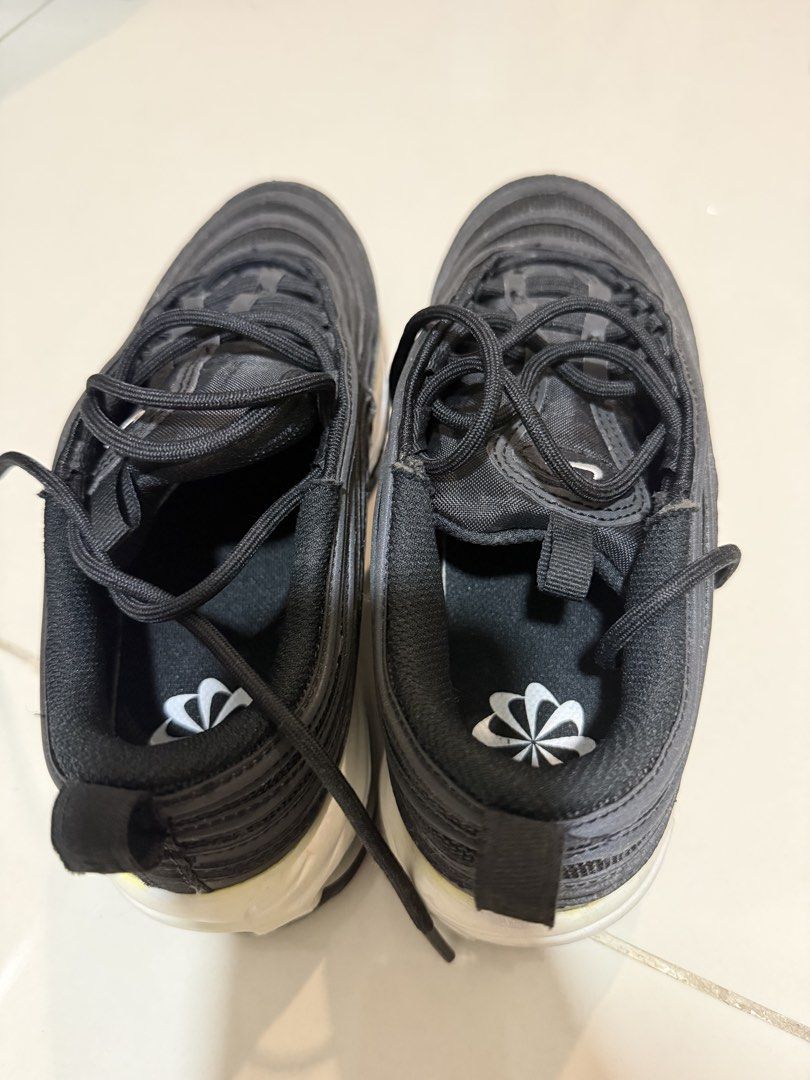 Nike Air Max 97 Black (Category: Sneakers) located in Caloocan City. Submitted by handdown_wear (Listing ID 1449884605, Image 2). Description: - Nike Air Max 97 - Color: Black - Size: US 8 / EUR 39 - Features classic wavy design - Ideal for everyday wear - Condition: Some yellowing on the midsole.