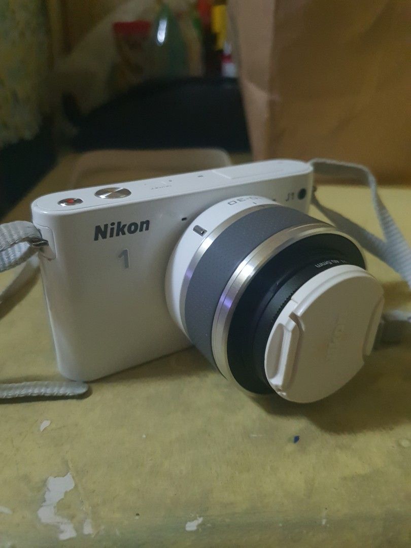 Nikon J1 (Category: Cameras) located in Manila. Submitted by zeyon360 (Listing ID 1449924658, Image 1). Description: Nikon 1 J1 - 7k -presentable -lens af working (no error) -flash working -with filet & strap - +1 new battery (battery charges directly thru usb c -4k+ "shutter" count -only issue is LCD + vignette but still useable and functioning Marikina area - shipping at your own cost.