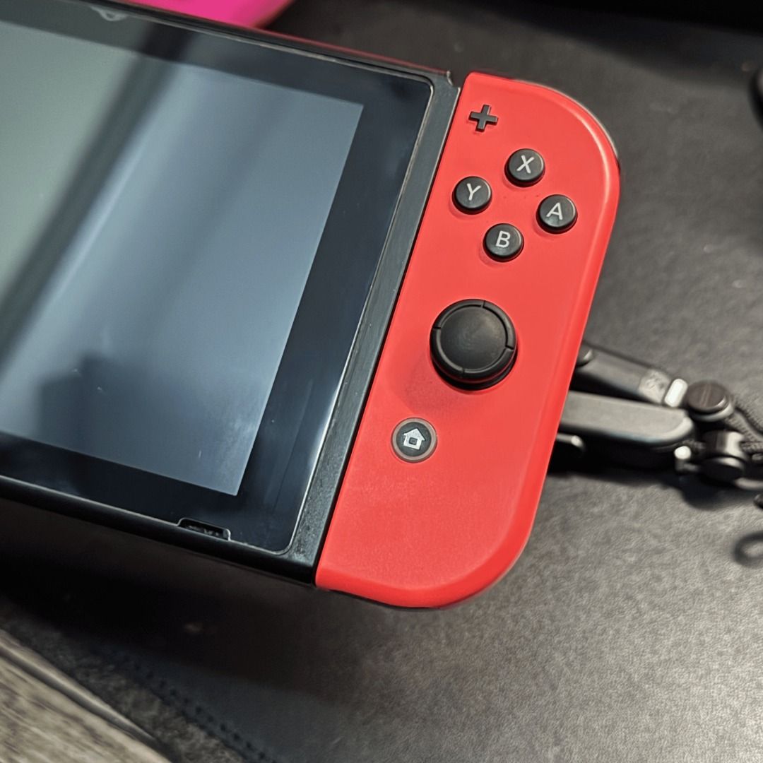Nintendo Switch V2 complete w/ Games & 1.4K PHP freebies (Category: Nintendo) located in Quezon City. Submitted by consoleciety (Listing ID 1449844147, Image 3). Description: Selling Nintendo Switch V2 complete for ₱9,299 —extremely presentable, 9.5/10 condition | tempered glass installed —no issue, everything working & checked according to my guide on how to buy 2nd hand (posted on T1kT0K) —includes complete accessories [no box] and Orzly Pink c