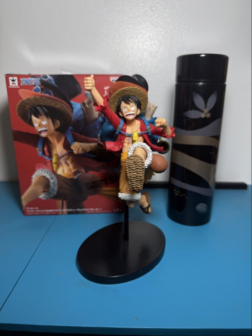 One Piece Monkey D. Luffy & Sabo Action Figure (Category: Figurines & Statues) located in Manila. Submitted by aprilluraine (Listing ID 1443795947, Image 1). Description: - Features Monkey D. Luffy and Sabo in dynamic action poses. - Luffy is depicted in his iconic red shirt and straw hat. - Sabo is layered on top, wearing his top hat and goggles. - Includes a black display stand for easy showcasing. - no scratches, dents, or missing parts - BOB.