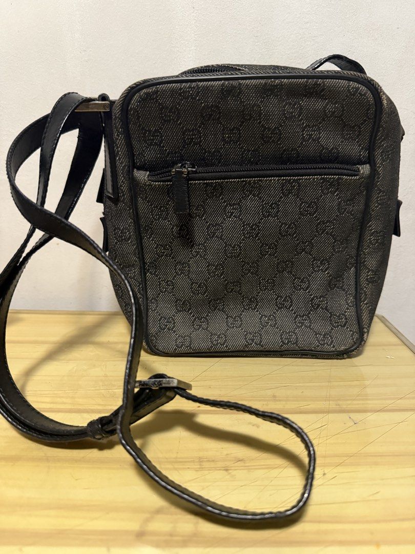 ORIG! Gucci bag mens (Category: Sling Bags) located in Makati City. Submitted by shopshophooray.ph (Listing ID 1449871907, Image 2). Description: ORIGINAL! Gucci bag for mens - P14,999 Origin: - bought at Hongkong preloved authentic store last 2023 Measures: 9 in - height 7 in - length 3 in - width Color: Black / Gray Material: Canvas (like denim material) Others: - strap is leather - strap is adjustable ITEM INCLUSION: - bag only NOT INCLUDED (t