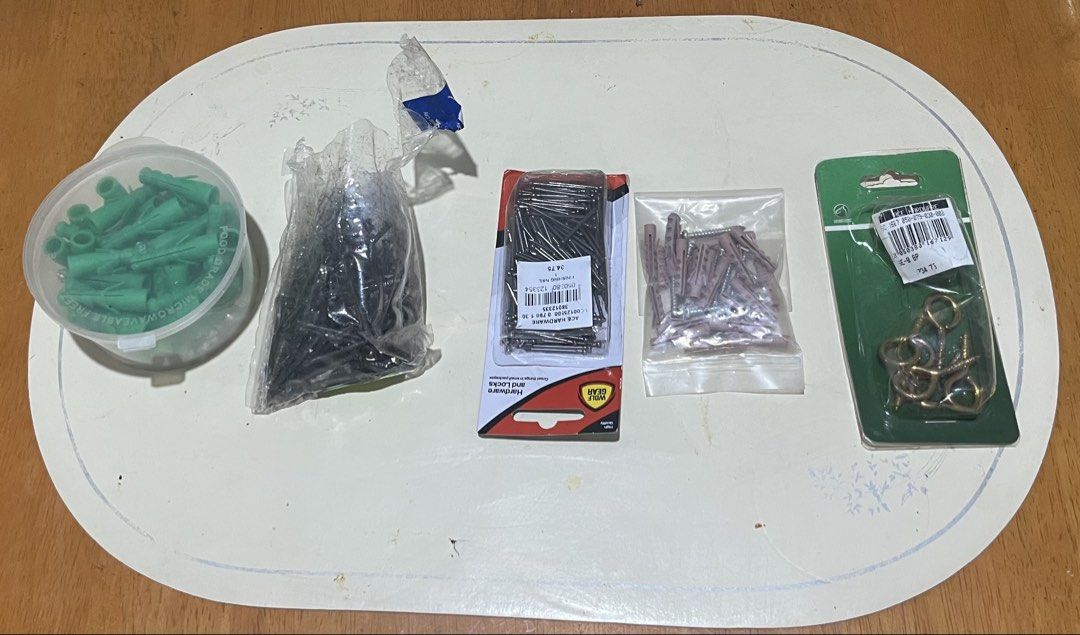 Powder Actuated Tool Nail Gun with Assorted Fasteners and Tools (Category: Construction Tools & Equipment) located in Pasig City. Submitted by jerryind107 (Listing ID 1449749484, Image 2). Description: - Powder actuated nail gun - Box of nails included - Assorted wall plugs, screws, and eye hooks - Set of pliers, screwdrivers, and adjustable wrench - Perfect for construction and DIY projects Sanitary items newly packed - All items as pictured.