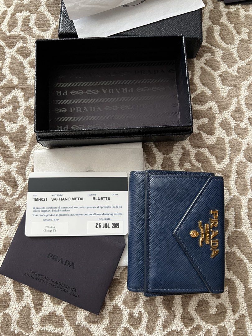 Prada Saffiano Metal Bluette Tri-fold Wallet (Category: Luxury Bags & Wallets) located in Santa Rosa. Submitted by charmainev31426 (Listing ID 1449762992, Image 1). Description: - Authentic Prada Saffiano Metal Wallet - Color: Bluette - Includes original box, authenticity card - Purchase Date: July 26, 2019 - Ideal for everyday use.