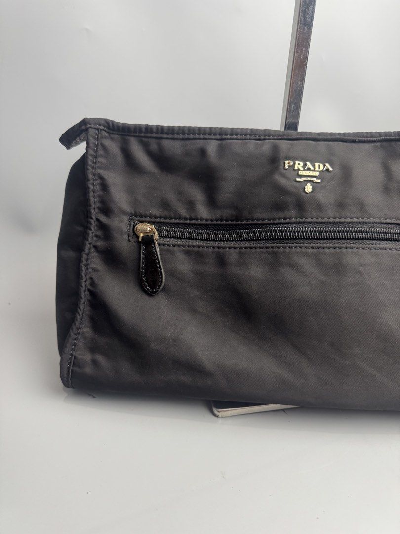 Prada -Tessuto Nylon Clutch Bag (Category: Luxury Bags & Wallets) located in San Pablo. Submitted by hiddenrygn (Listing ID 1449879957, Image 2). Description: Prada -Tessuto Nylon Clutch Bag Rank AB Minor signs of usage Still in excellent condition NGA DM!.