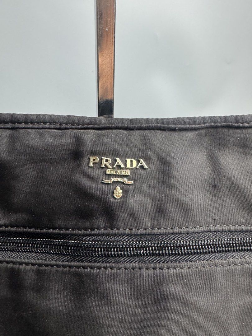 Prada -Tessuto Nylon Clutch Bag (Category: Luxury Bags & Wallets) located in San Pablo. Submitted by hiddenrygn (Listing ID 1449879957, Image 3). Description: Prada -Tessuto Nylon Clutch Bag Rank AB Minor signs of usage Still in excellent condition NGA DM!.
