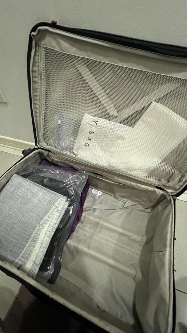 Preloved: Samsonite Super Light Large Luggage (Category: Luggage) located in Manila. Submitted by irockmysocks_ogee (Listing ID 1449757005, Image 2). Description: - Large Samsonite spinner luggage in black - Ideal for extended travel - Interior features mesh pockets and securing straps for organization - Convenient front zip pocket on the exterior - Wheels roll smoothly for easy maneuverability.