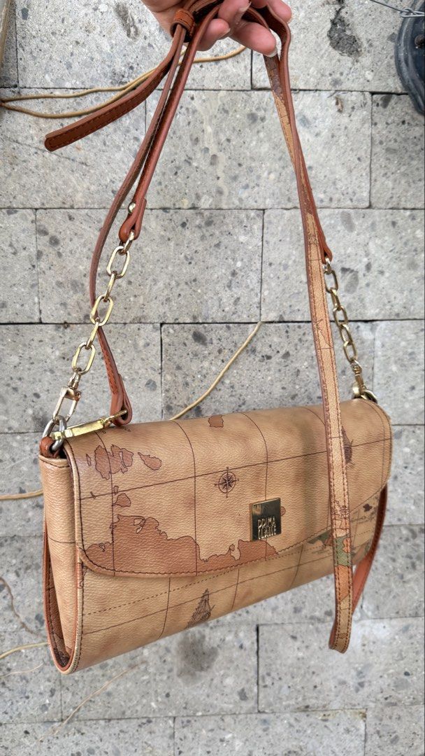 Prima Classe Map Bag (Category: Cross-body Bags) located in Malolos. Submitted by flapnbloom.ph (Listing ID 1449912997, Image 2). Description: - Prima Classe clutch shoulder crossbody bag 3-way - Detachable straps - Flaw is on the inner magnetic closure but in working condition.Refer to last photo..