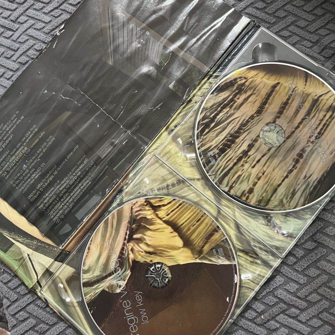 Regine Velasquez - Low Key (Category: CDs & DVDs) located in Caloocan City. Submitted by thelittlejewelcase (Listing ID 1449940616, Image 2). Description: cover and inlay has water damaged ‼️ but CDs are in excellent condition ✨.