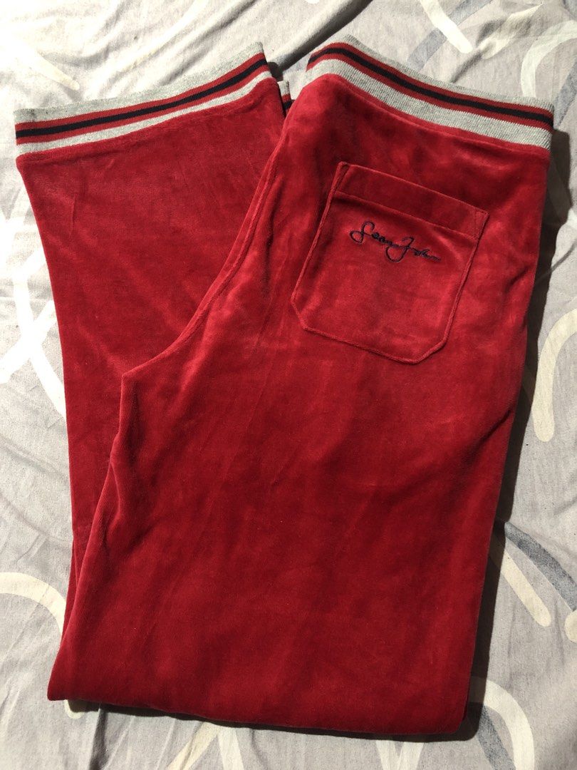Sean John Red Velour Track Pants Size M (Category: Joggers) located in Manila. Submitted by bakithrift213 (Listing ID 1449951375, Image 3). Description: - Sean John red velour track pants - Size: Medium - Elastic waistband with drawstring - Back pocket with embroidered logo - Striped detailing at waistband and cuffs - Perfect for lounging or casual wear.