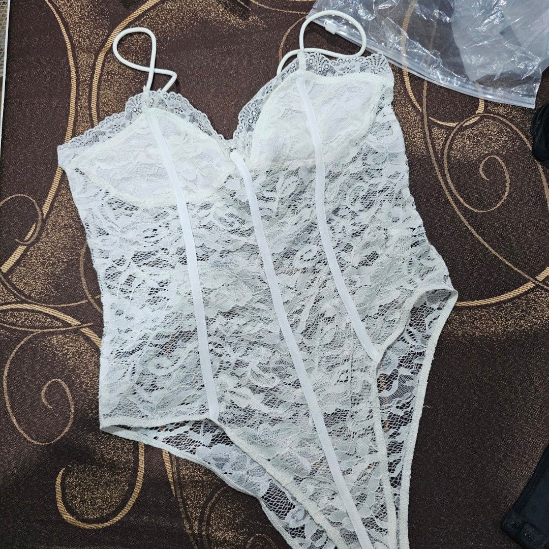 Shein Black & White Lace Bodysuit with Straps (Category: Others Tops) located in Cavite. Submitted by frombellas (Listing ID 1449791668, Image 2). Description: - Set includes one black (size large) and one white lace (size XL) bodysuit. - Features delicate thin straps. - Crafted from lace with horizontal ribbed detailing. - Versatile: can be worn as lingerie or a fashion statement. - Sold as a set of two..