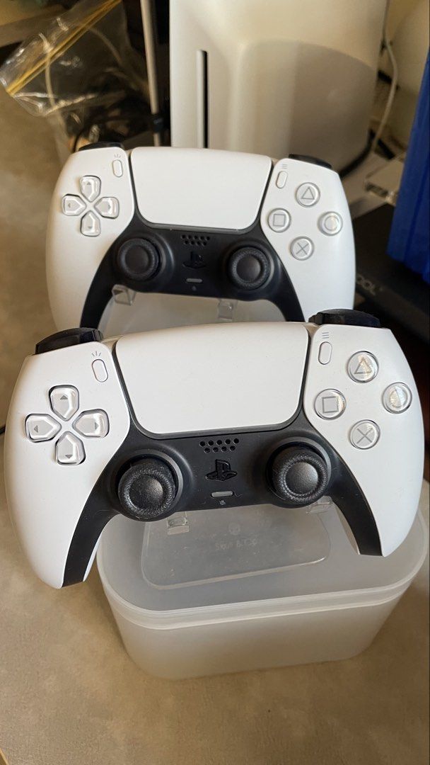Sony Playstation PS5 Slim Console Two Dualsense Wireless Controllers Bundle (Asia-00497) (Category: PlayStation) located in Manila. Submitted by trivelle (Listing ID 1449792735, Image 3). Description: Excellent condition Fully functional with no issues Rarely used Complete with original accessories (2 consoles) Includes original box Purchased from DataBlitz Rfs: migrating Will throw in ps5 stand and console stand Pick up c/buyer.