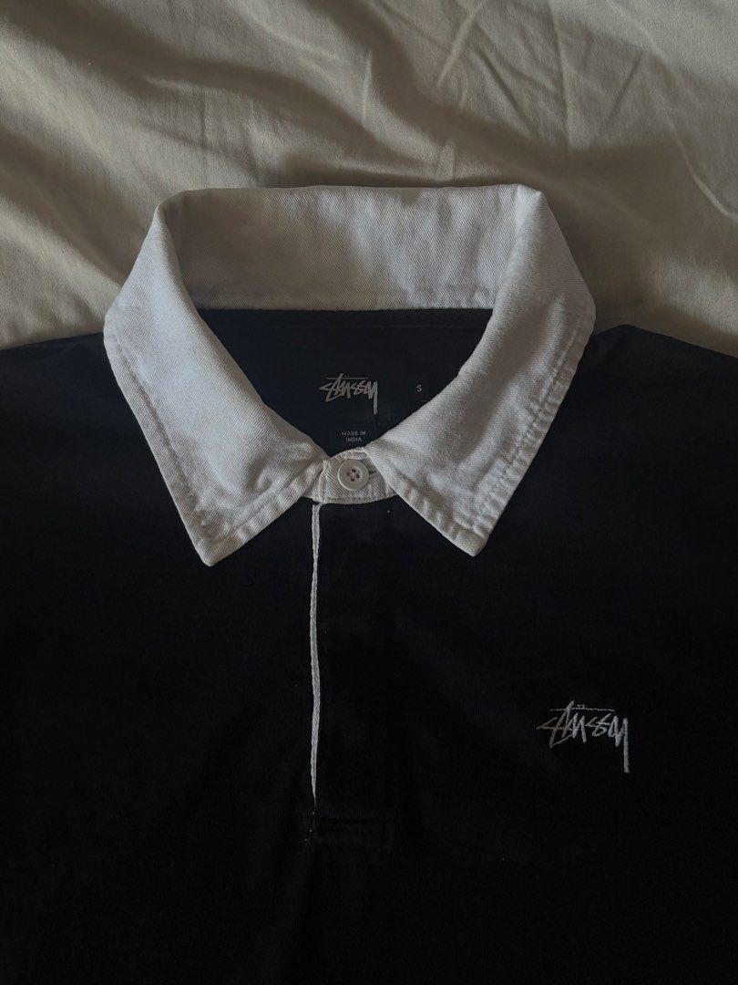 Stussy Black Rugby Polo LS (Category: Tshirts & Polo Shirts ) located in Paranaque City. Submitted by cur8dfinds (Listing ID 1449823384, Image 2). Description: - S on tag (20x26.5) - Issues: stains on the cuffs - Color rate: 9.5/10 - Needs wash.