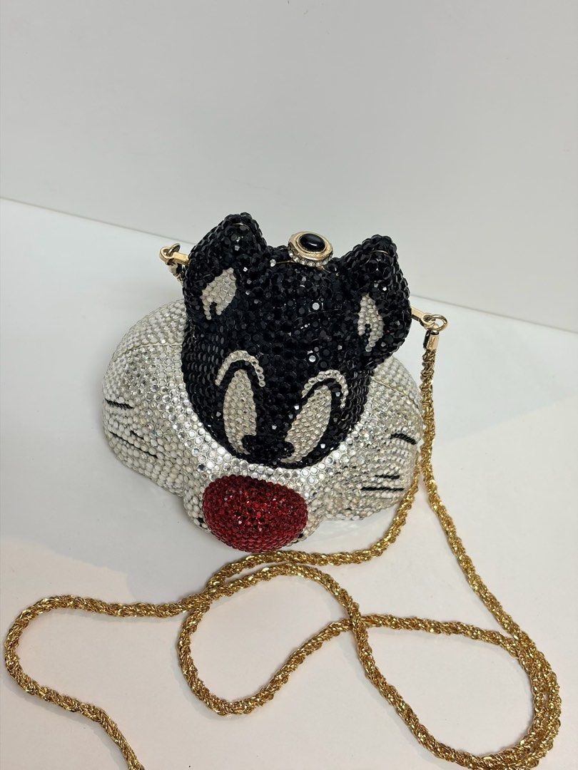 Sylvester the Cat Rhinestone Clutch Bag (Category: Clutches) located in Makati City. Submitted by chumamba (Listing ID 1449950239, Image 2). Description: - Super cute Sylvester the Cat clutch bag - Covered in sparkly rhinestones - Features a red nose detail - Includes a gold chain strap - Ideal for parties or a fun night out - A unique statement piece.