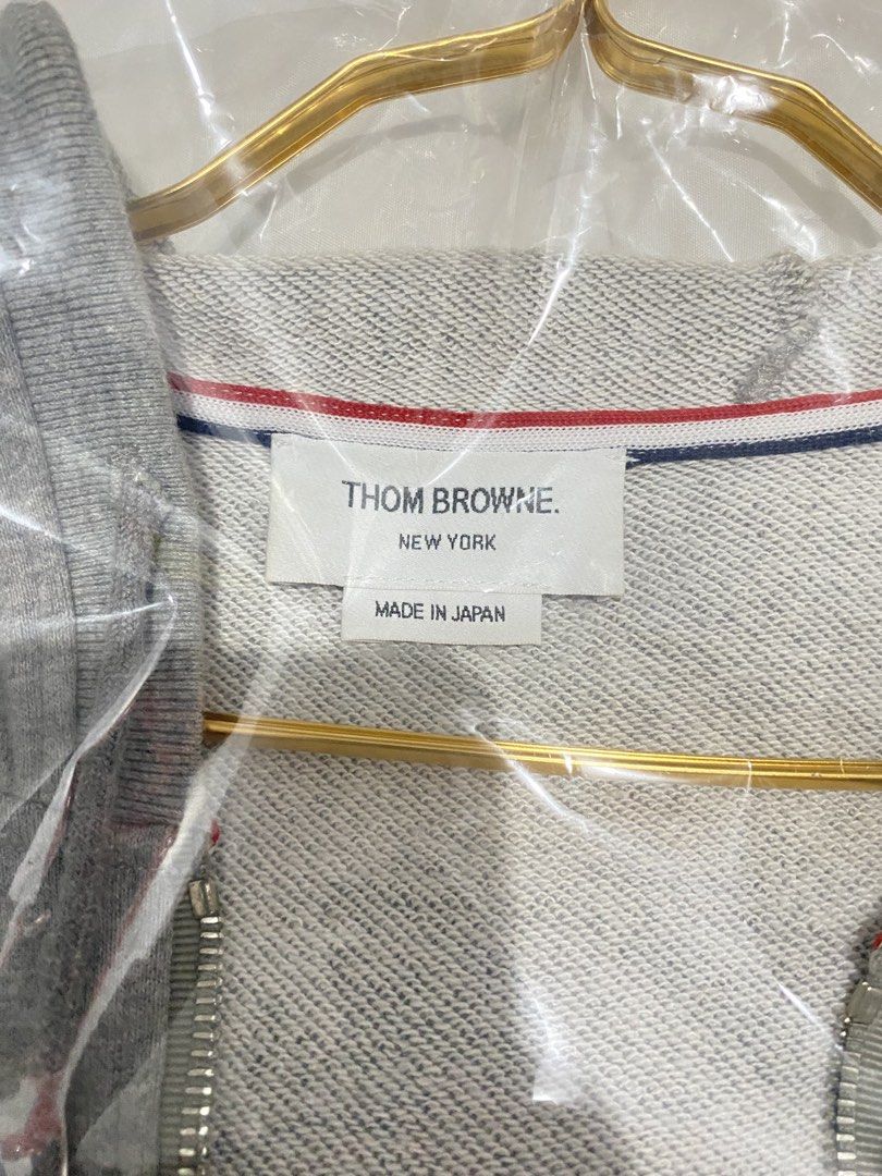 Thom Browne 4-Bar Zip-Up Hoodie (Category: Coats, Jackets and Outerwear) located in Cavite. Submitted by JandyLou (Listing ID 1449812660, Image 3). Description: Carousell Listings Title: Thom Browne 4-bar zip-up hoodie Grey Size: Medium Mens Size 2 Condition: Like New (Color may vary due to lighting) Price: Php 2,000 Flaws: No Flaws Payment Methods: Payment first via Gcash Delivery Options (shoulder by buyer): Lalamove, Lbc or J&T delivery. NO CA
