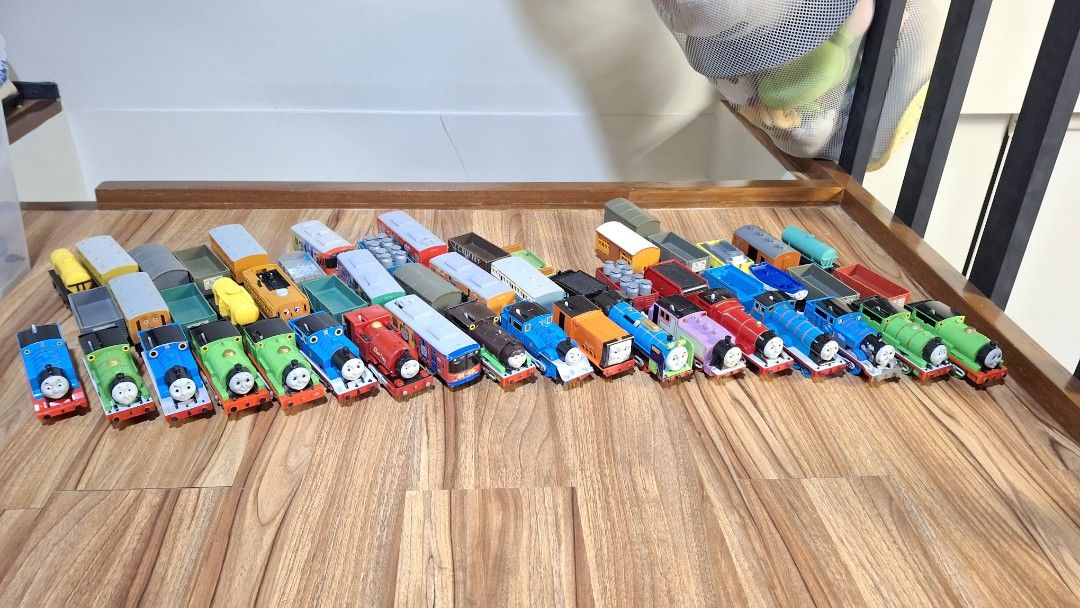 Thomas and Friends Toy Trains Collection (Category: Vehicle & Diecast Models) located in Manila. Submitted by angm1455955638 (Listing ID 1449865264, Image 1). Description: - Large collection of Thomas and Friends wooden railway toy trains. - Features popular characters like Thomas, Percy, and James. - Includes various carriages and wagons. - All pieces are made of durable wood. - Connects magnetically for easy assembly. - Perfect for imaginative 
