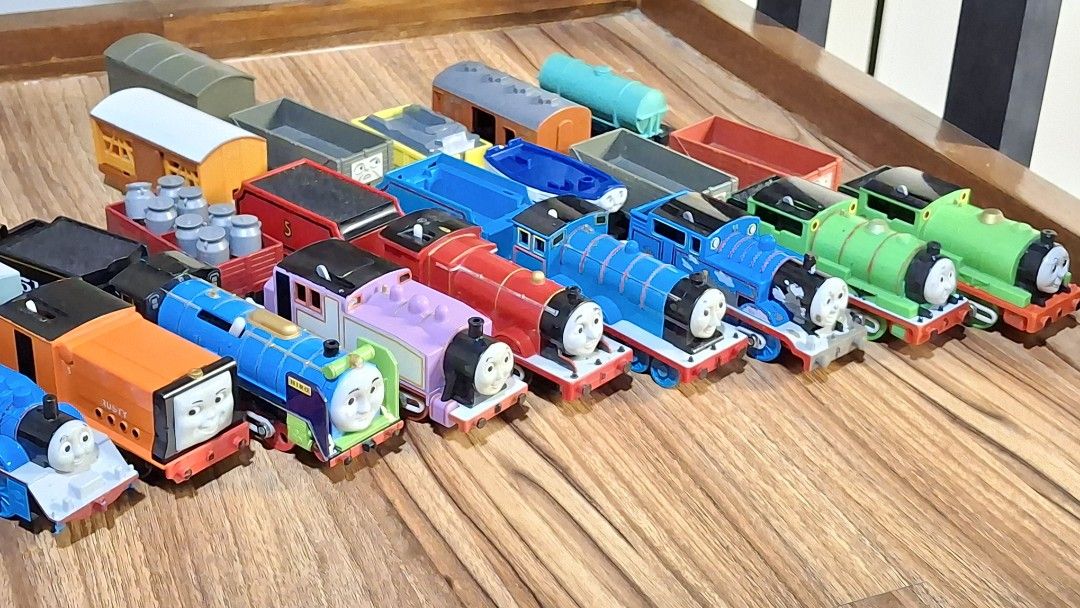 Thomas and Friends Toy Trains Collection (Category: Vehicle & Diecast Models) located in Manila. Submitted by angm1455955638 (Listing ID 1449865264, Image 2). Description: - Large collection of Thomas and Friends wooden railway toy trains. - Features popular characters like Thomas, Percy, and James. - Includes various carriages and wagons. - All pieces are made of durable wood. - Connects magnetically for easy assembly. - Perfect for imaginative 