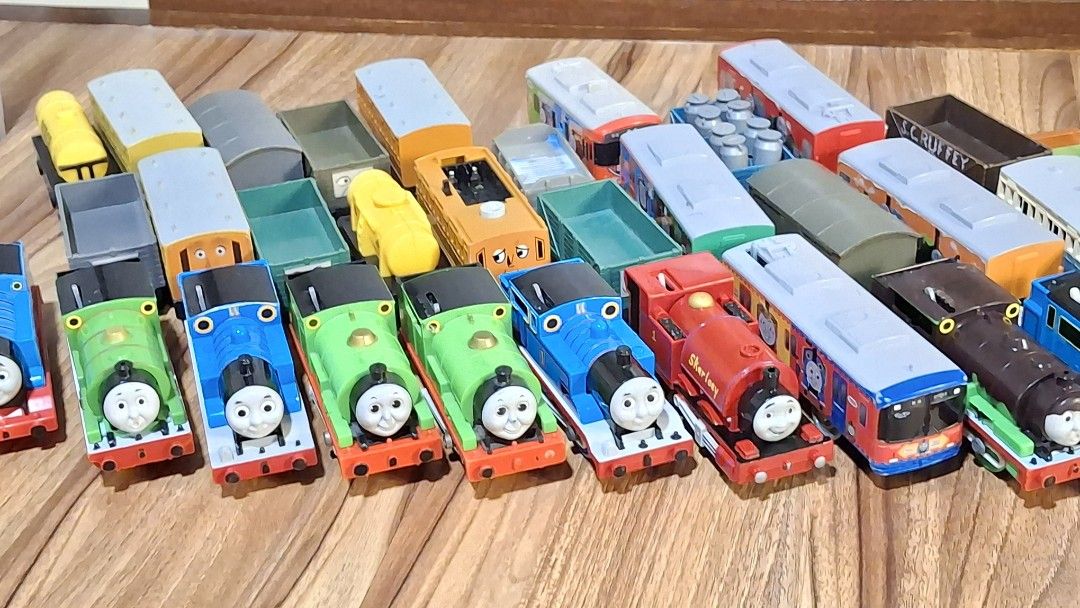 Thomas and Friends Toy Trains Collection (Category: Vehicle & Diecast Models) located in Manila. Submitted by angm1455955638 (Listing ID 1449865264, Image 3). Description: - Large collection of Thomas and Friends wooden railway toy trains. - Features popular characters like Thomas, Percy, and James. - Includes various carriages and wagons. - All pieces are made of durable wood. - Connects magnetically for easy assembly. - Perfect for imaginative 