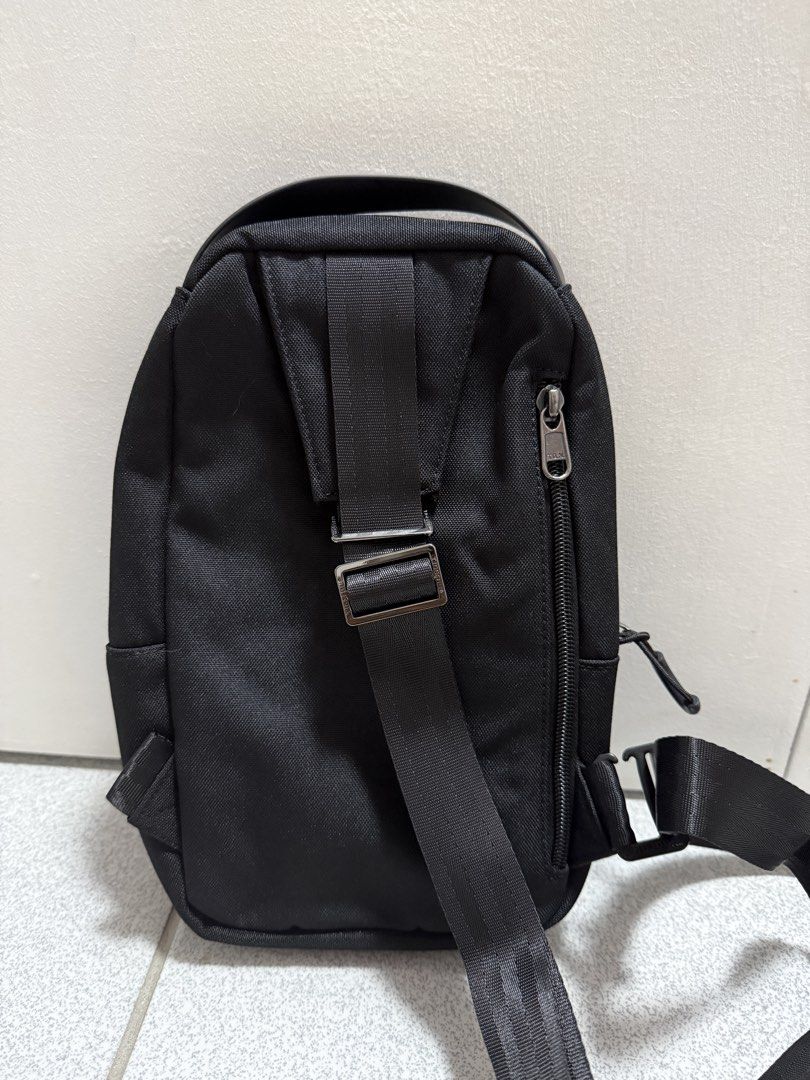 TIGERU Black Sling Bag (Category: Sling Bags) located in San Jose del Monte. Submitted by hellocutease (Listing ID 1449773535, Image 2). Description: - Durable black TIGERU sling bag - Multiple compartments and zippers for organization - Adjustable strap for a comfortable fit - Ideal for everyday use.