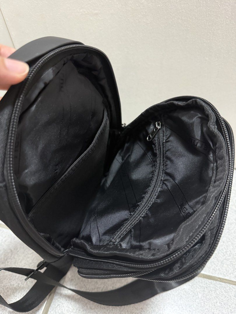 TIGERU Black Sling Bag (Category: Sling Bags) located in San Jose del Monte. Submitted by hellocutease (Listing ID 1449773535, Image 3). Description: - Durable black TIGERU sling bag - Multiple compartments and zippers for organization - Adjustable strap for a comfortable fit - Ideal for everyday use.