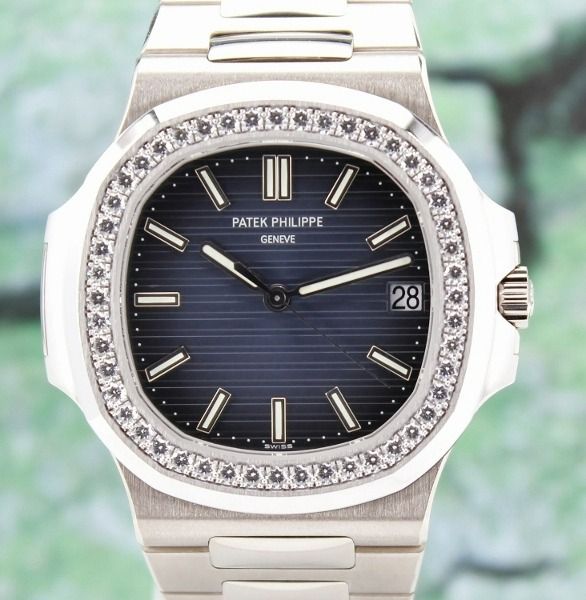 UNWORN PATEK PHILIPPE 18K WHITE GOLD NAUTILUS / 5713/1G-010 / CERT (Category: Watches) located in Singapore. Submitted by hjluxury (Listing ID 1449885129, Image 1). Description: Reference: 5713/1G-010 Original Box & Certificate Oct 2013 An extraordinary blend of haute horlogerie and high jewellery, the Patek Philippe Nautilus Reference 5713/1G-010 is one of the most prestigious and sought-after luxury sports watches ever produced. Presented in un