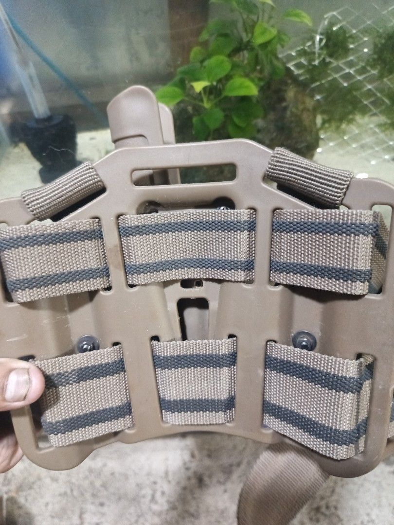 USMC Drop Leg Serpa Beretta Holster (Category: Other Sports Equipment and Supplies) located in Caloocan City. Submitted by aquasaurus (Listing ID 1449952337, Image 3). Description: - Tan tactical drop leg holster - Includes a double magazine pouch - Adjustable straps for a secure fit - MOLLE compatible for vests or bags - Ideal for airsoft or tactical gear setups.
