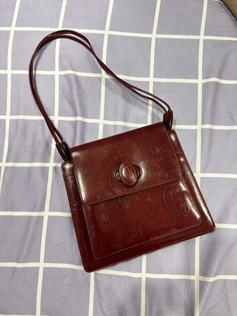 Vintage Cartier (Category: Luxury Bags & Wallets) located in Navotas City. Submitted by minaly_ (Listing ID 1449924001, Image 2). Description: Vintage Cartier Shoulder Bag Burgundy Leather Dual Shoulder Straps Single Exterior Pocket Logo Jacquard Lining & Single Interior Pocket Turn-Lock Closure at Front Dm me for the price Super nice in person! 100% guaranteed authentic.