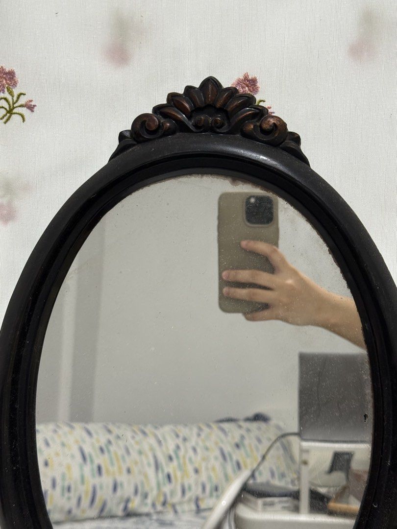 Vintage Oval Mirror with Ornate Dark Hard Plastic Frame (Category: Mirrors) located in Mandaluyong City. Submitted by toby.yumi (Listing ID 1449757403, Image 2). Description: Vintage oval mirror with a dark, ornate hard plastic frame. Features decorative carvings and a Japanese label. Perfect for vanity or entryway..