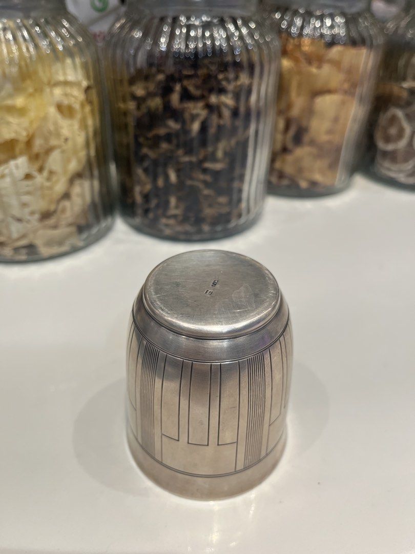 Vintage Silver Cup with Geometric Design (Category: Coffee & Tea Tableware) located in Iloilo. Submitted by yangfire (Listing ID 1449864084, Image 3). Description: - Unique vintage cup - Features an etched geometric pattern - Smooth and clean interior - Maker's mark possibly present on the bottom - Substantial, nice weight - Ideal for collectors or as a decorative accent what you see in the picture is what u can get.