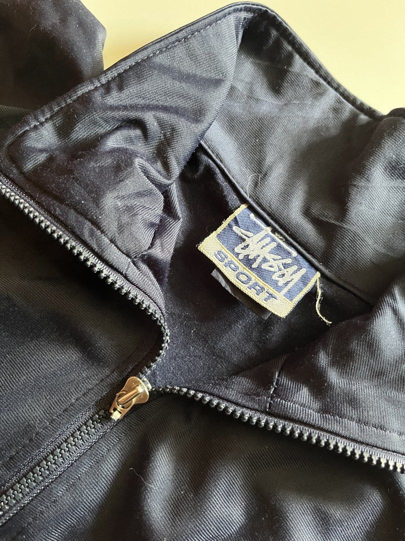 Vintage Stussy Track Jacket (Category: Coats, Jackets and Outerwear) located in Santa Ana. Submitted by rlave (Listing ID 1449877468, Image 3). Description: Preloved vintage Stüssy track jacket, sourced from a trusted supplier. Features the classic Stüssy branding/logo, retro track jacket silhouette, full-zip closure, and a laid-back streetwear fit — a solid pick for collectors or everyday wear. Item is in good preloved condition with the charact