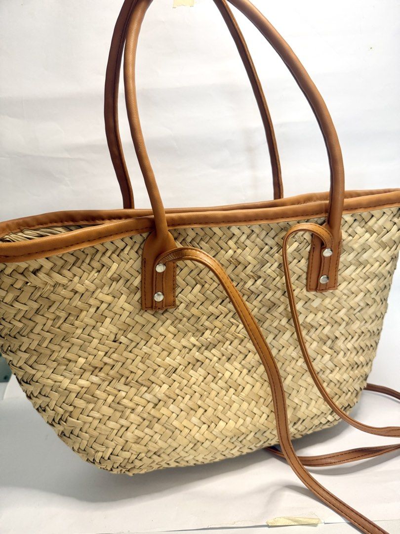 Woven beach tote (Category: Beach Bags) located in Mandaluyong City. Submitted by cherryspicks (Listing ID 1449912879, Image 2). Description: Never used . A little wonky from keeping on the closet, but can be reshaped :) nice medium size, very spacious. No locks or zip. Has a longer straps, too , for the shoulder. .